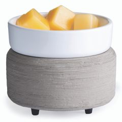 Grey and gold 2-in-1 wax warmer holding melted wax in the dish