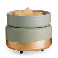 Sage green and gold 2-in-1 wax warmer with melted wax in the dish