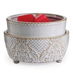 White and gold patterned 2-in-1 wax warmer with red melted wax in the dish
