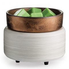 Copper and white 2-in-1 wax warmer with green melted wax in the dish